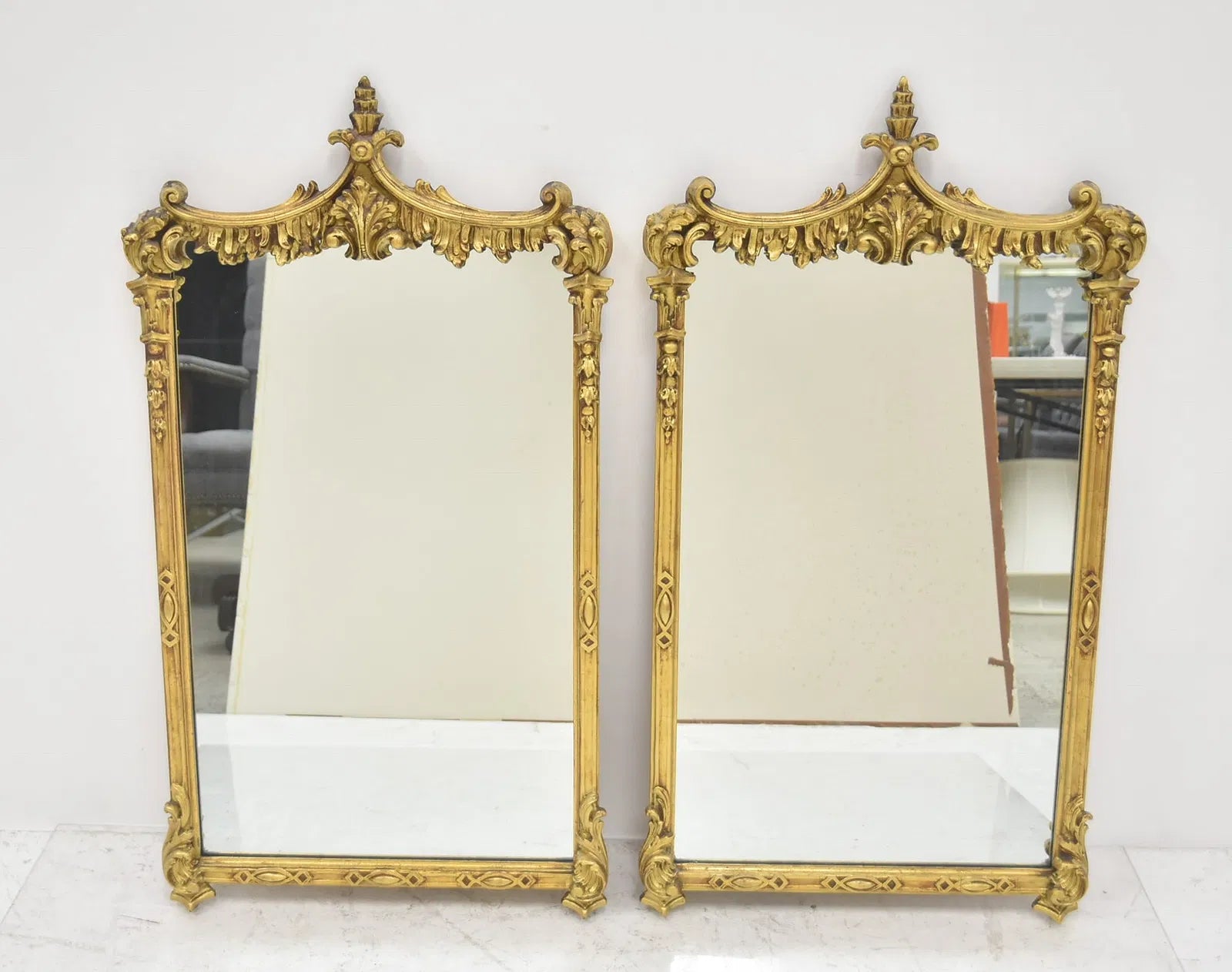 Pair Of Carved And Gilt Mirrors