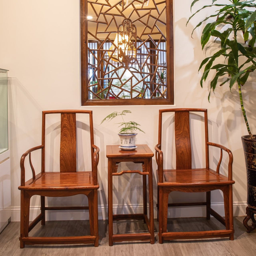 A Set Of Chinese Rosewood Yokeback Armchairs