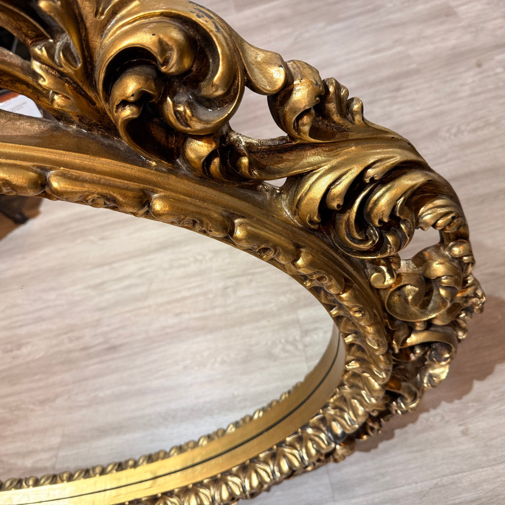 Ornate Giltwood Oval Mirror with Carved Scrollwork