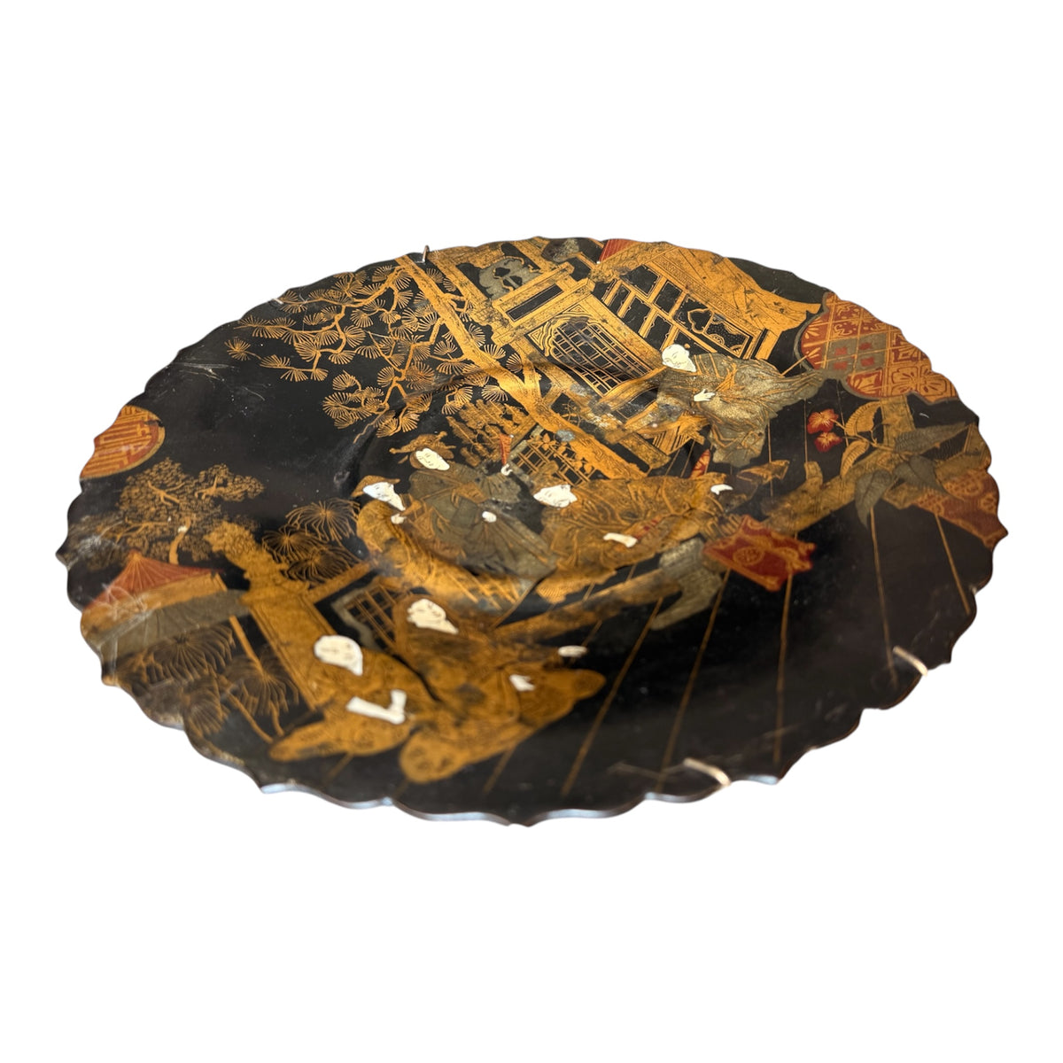 An oval black lacquered serving platter with a detailed gold and brown Chinese-style landscape scene and small white inlay accents, shown on a plain white background.